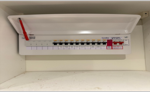 Modern metal consumer unit fitted with individual RCBOs and surge protection.